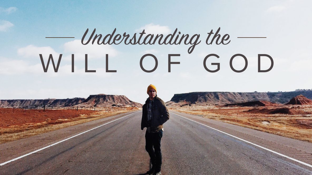 understanding the will of God - man standing in road between mountains
