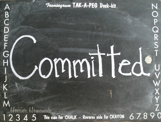 Committed written on blackboard